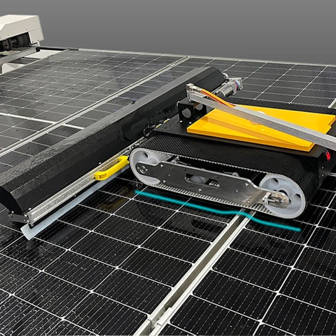 Drive track and squeegee head detail on a cleaning robot